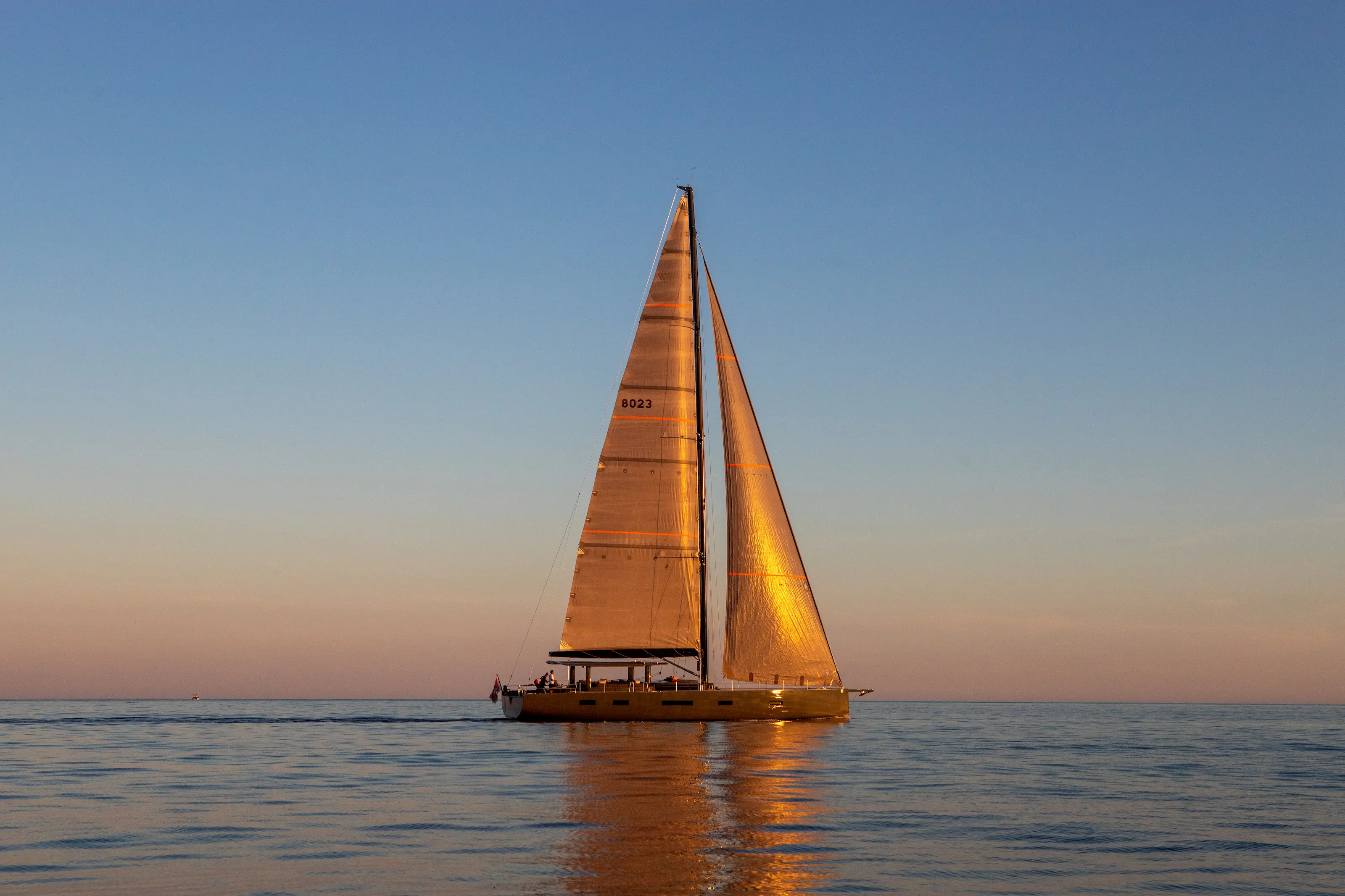 Sailing Yacht W under full sail at golden hour in the Mediterranean, 24 m YYachts Y8 carbon race cruiser
