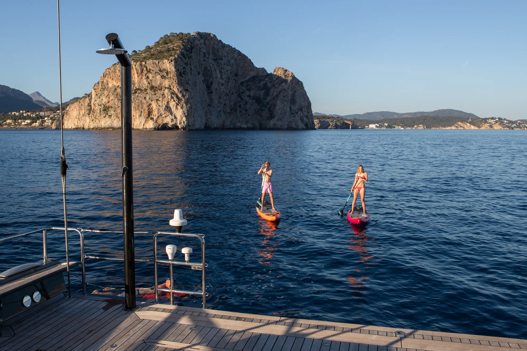 Paddleboarding in a calm Mediterranean bay near the Sailing Yacht W